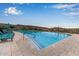 Resort-style pool with plenty of lounge chairs at 31817 N 124Th Dr, Peoria, AZ 85383