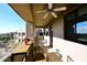 Relaxing balcony with outdoor furniture and ceiling fan at 34457 N Legend Trail Pkwy # 2008, Scottsdale, AZ 85262