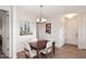 Simple dining area with wood table and four chairs at 34457 N Legend Trail Pkwy # 2008, Scottsdale, AZ 85262