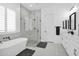 Modern bathroom with a soaking tub, walk-in shower, and double vanity at 3588 W New Life Ln, Queen Creek, AZ 85144