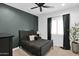 Serene bedroom with a queen bed and dark green accent wall at 3588 W New Life Ln, Queen Creek, AZ 85144