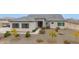 Single-story home with gray roof and landscaped yard at 3588 W New Life Ln, Queen Creek, AZ 85144