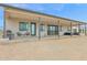 Backyard view of a modern home with covered patio at 3588 W New Life Ln, Queen Creek, AZ 85144