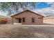 Spacious backyard with gravel and a covered patio at 3663 S Hassett --, Mesa, AZ 85212