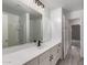 Modern bathroom with white vanity, black faucet, and large mirror at 3663 S Hassett --, Mesa, AZ 85212