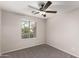 Bright bedroom with ceiling fan and carpeted floor at 3663 S Hassett --, Mesa, AZ 85212