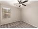 Well-lit bedroom with ceiling fan and carpet flooring at 3663 S Hassett --, Mesa, AZ 85212