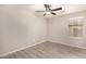 Bright bedroom with ceiling fan, window blinds, and laminate flooring at 3663 S Hassett --, Mesa, AZ 85212