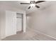 Bedroom with ceiling fan, carpet, and a large closet at 3663 S Hassett --, Mesa, AZ 85212