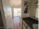 Bathroom with vanity, sink and access to bedroom at 3840 N 43Rd Ave # 48, Phoenix, AZ 85031