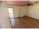 Bedroom with balcony access and wood floors at 3840 N 43Rd Ave # 48, Phoenix, AZ 85031