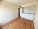 Light bedroom with wood floors and built-in shelves at 3840 N 43Rd Ave # 48, Phoenix, AZ 85031