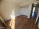 Bedroom with wood floors and mirrored closet at 3840 N 43Rd Ave # 48, Phoenix, AZ 85031