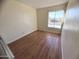 Spacious bedroom with wood floors and window at 3840 N 43Rd Ave # 48, Phoenix, AZ 85031