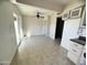 Simple dining area with tile flooring and access to patio at 3840 N 43Rd Ave # 48, Phoenix, AZ 85031