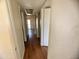 Simple hallway with light walls and wood flooring at 3840 N 43Rd Ave # 48, Phoenix, AZ 85031