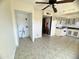 Kitchen with light cabinets, tile floor, and access to laundry at 3840 N 43Rd Ave # 48, Phoenix, AZ 85031