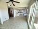 Kitchen with light cabinets, tile floor, and access to patio at 3840 N 43Rd Ave # 48, Phoenix, AZ 85031