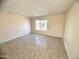 Living room with tile flooring and window at 3840 N 43Rd Ave # 48, Phoenix, AZ 85031