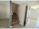 Stone-look stairs leading to upper level with storage at 3840 N 43Rd Ave # 48, Phoenix, AZ 85031