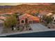 Single story home with a two-car garage and desert landscaping at 4202 S Cordia Ct, Gold Canyon, AZ 85118