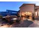 Evening view of backyard oasis with fire pit and spa at 4202 S Cordia Ct, Gold Canyon, AZ 85118