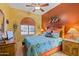 Guest bedroom with Southwestern decor and ceiling fan at 4202 S Cordia Ct, Gold Canyon, AZ 85118