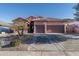 Two-story stucco home with tile roof, two-car garage, and desert landscaping at 4202 S Cordia Ct, Gold Canyon, AZ 85118