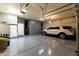 Bright garage with epoxy flooring, extra storage, and room for two cars at 4202 S Cordia Ct, Gold Canyon, AZ 85118