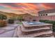 Spacious hot tub with stone surround and mountain backdrop at 4202 S Cordia Ct, Gold Canyon, AZ 85118