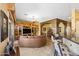 Open living room with leather sectional and kitchen views at 4202 S Cordia Ct, Gold Canyon, AZ 85118