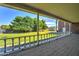 Spacious back porch with a view of the lush backyard and well maintained lawn at 424 E Lehi Rd, Mesa, AZ 85203