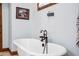 Elegant bathroom with freestanding tub and antique-style faucet at 424 E Lehi Rd, Mesa, AZ 85203