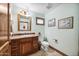 Clean bathroom with wood vanity and granite countertop at 424 E Lehi Rd, Mesa, AZ 85203