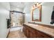 Guest bathroom with granite vanity and tiled floor at 424 E Lehi Rd, Mesa, AZ 85203