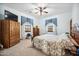 Bedroom with floral bedding and large windows at 424 E Lehi Rd, Mesa, AZ 85203