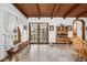 Rustic dining area with wood floors and French doors at 424 E Lehi Rd, Mesa, AZ 85203