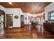 Bright dining room with hardwood floors, a chandelier, and bay windows at 424 E Lehi Rd, Mesa, AZ 85203