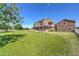 Stately brick home with a sprawling lawn, inviting porch, and a charming, picturesque setting at 424 E Lehi Rd, Mesa, AZ 85203