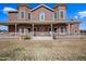 Two-story brick house with a large front porch and landscaping at 424 E Lehi Rd, Mesa, AZ 85203