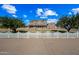 Two-story brick home with a white picket fence and a large front yard at 424 E Lehi Rd, Mesa, AZ 85203