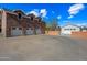 Triple-car garage with brick exterior and white doors at 424 E Lehi Rd, Mesa, AZ 85203