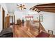 Upstairs hallway with hardwood floors and ceiling fan at 424 E Lehi Rd, Mesa, AZ 85203