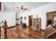 Upper hallway with hardwood floors and built-in bookcase at 424 E Lehi Rd, Mesa, AZ 85203