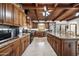 Kitchen with wood cabinets, granite counters and island at 424 E Lehi Rd, Mesa, AZ 85203