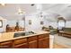 Kitchen with an island and views into the living room at 424 E Lehi Rd, Mesa, AZ 85203