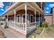 Front porch with white columns and railings, offering a relaxing view at 424 E Lehi Rd, Mesa, AZ 85203