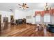 Sitting area with hardwood floors, bay window and entertainment center at 424 E Lehi Rd, Mesa, AZ 85203