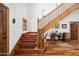 View of a wooden staircase with a red runner at 424 E Lehi Rd, Mesa, AZ 85203