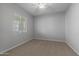 Bright bedroom featuring carpet and a window with blinds at 4267 E Bernice St, Gilbert, AZ 85295